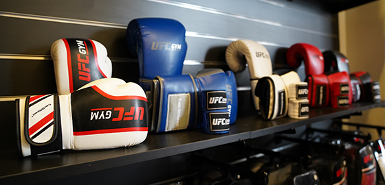 photo of white, blue, and red UFC Gym boxing gloves