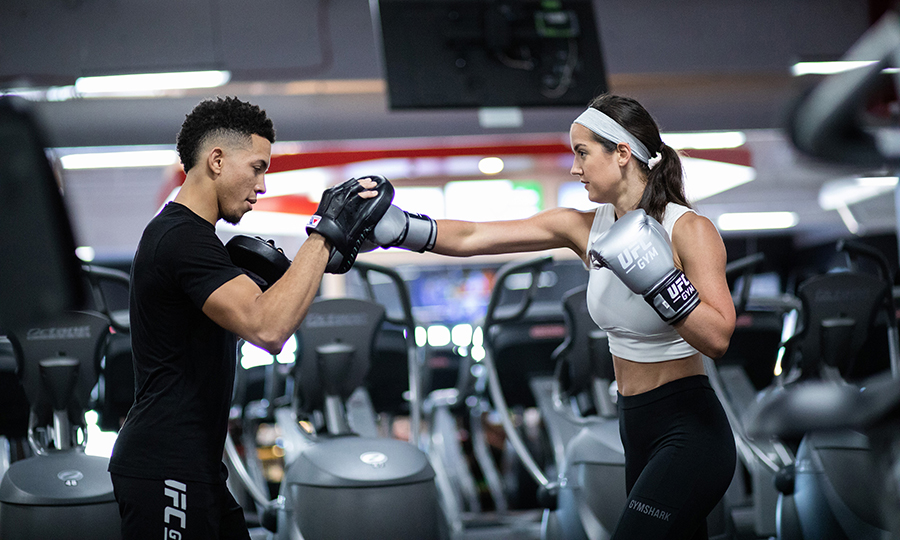 Image of two people training in a gym