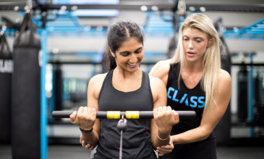 Image of two women training in gym