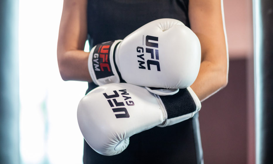 Image of a close-up of a person with white boxing gloves